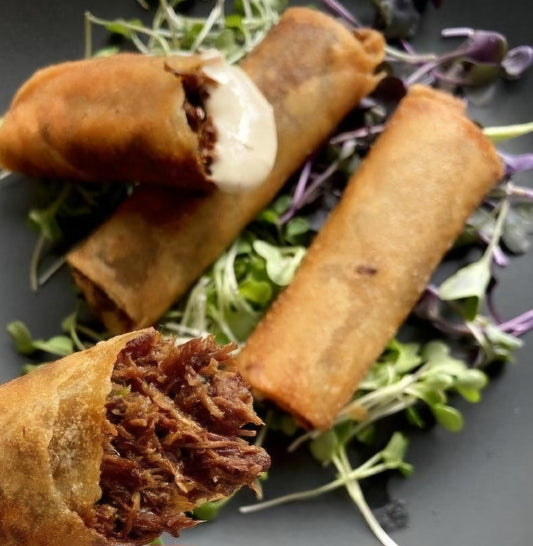 Sweet beef cigars with fresh herbs, cashews, and dried fruits served with tehini (3 pcs)