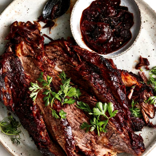 Slow roasted beef brisket reduced in a plum sauce with fresh herbs per (1lb Servings 2+)